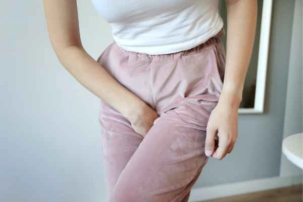 older woman running to the toilet because of urinary incontinence West Bromwich